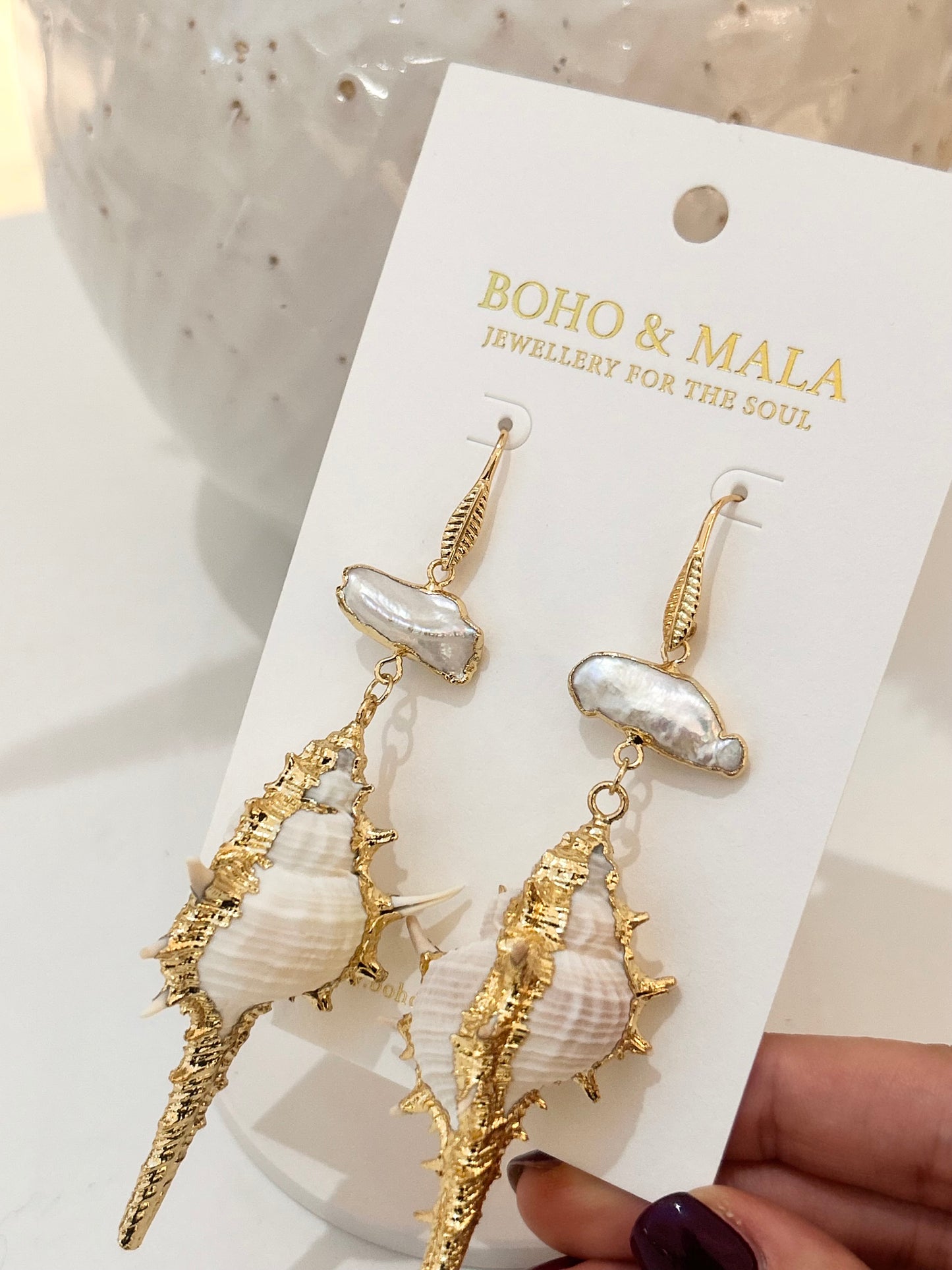
                  
                    Pearl Conch Earrings
                  
                