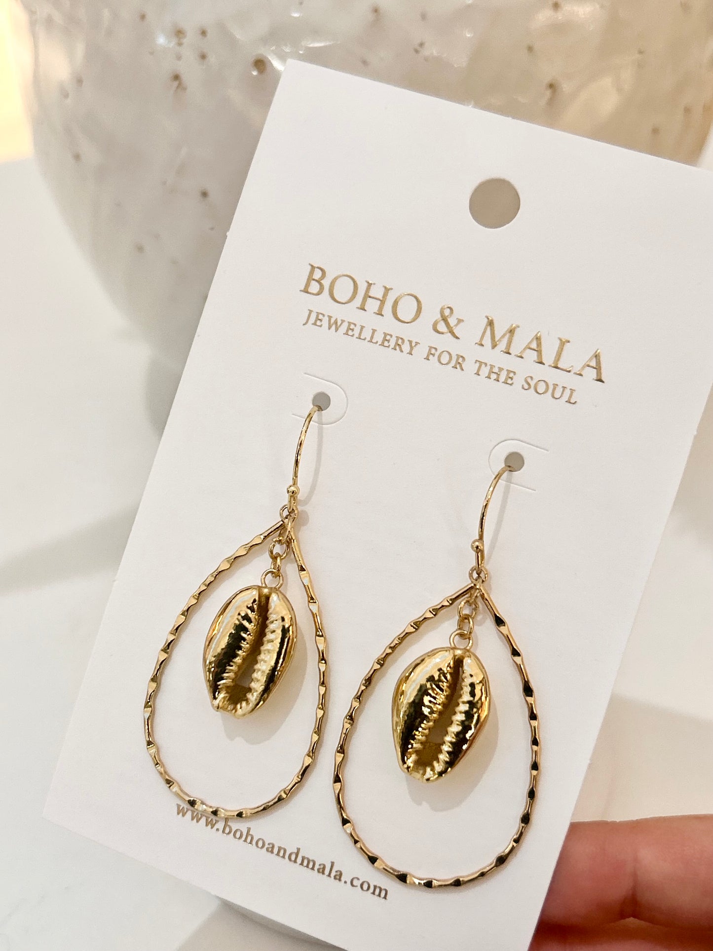 
                  
                    Oceanus Cowrie Earrings
                  
                