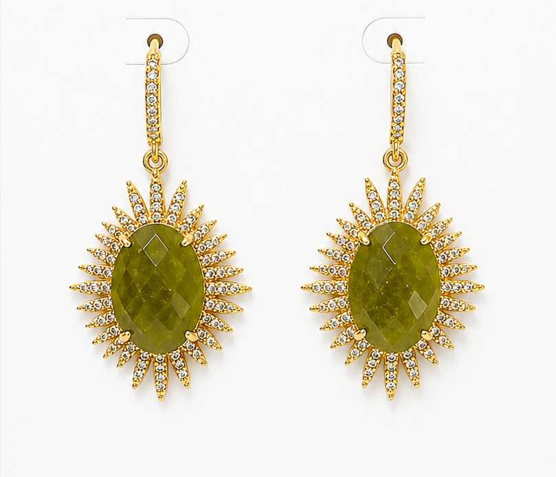 Pair of gold earrings with green stones on a BOHO & MALA branded card.