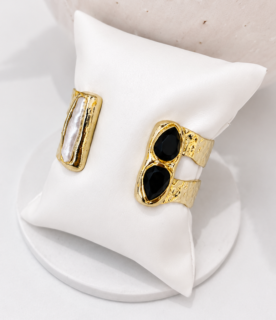 
                  
                    Gold open cuff with black obsidian details with freshwater pearl inlays
                  
                