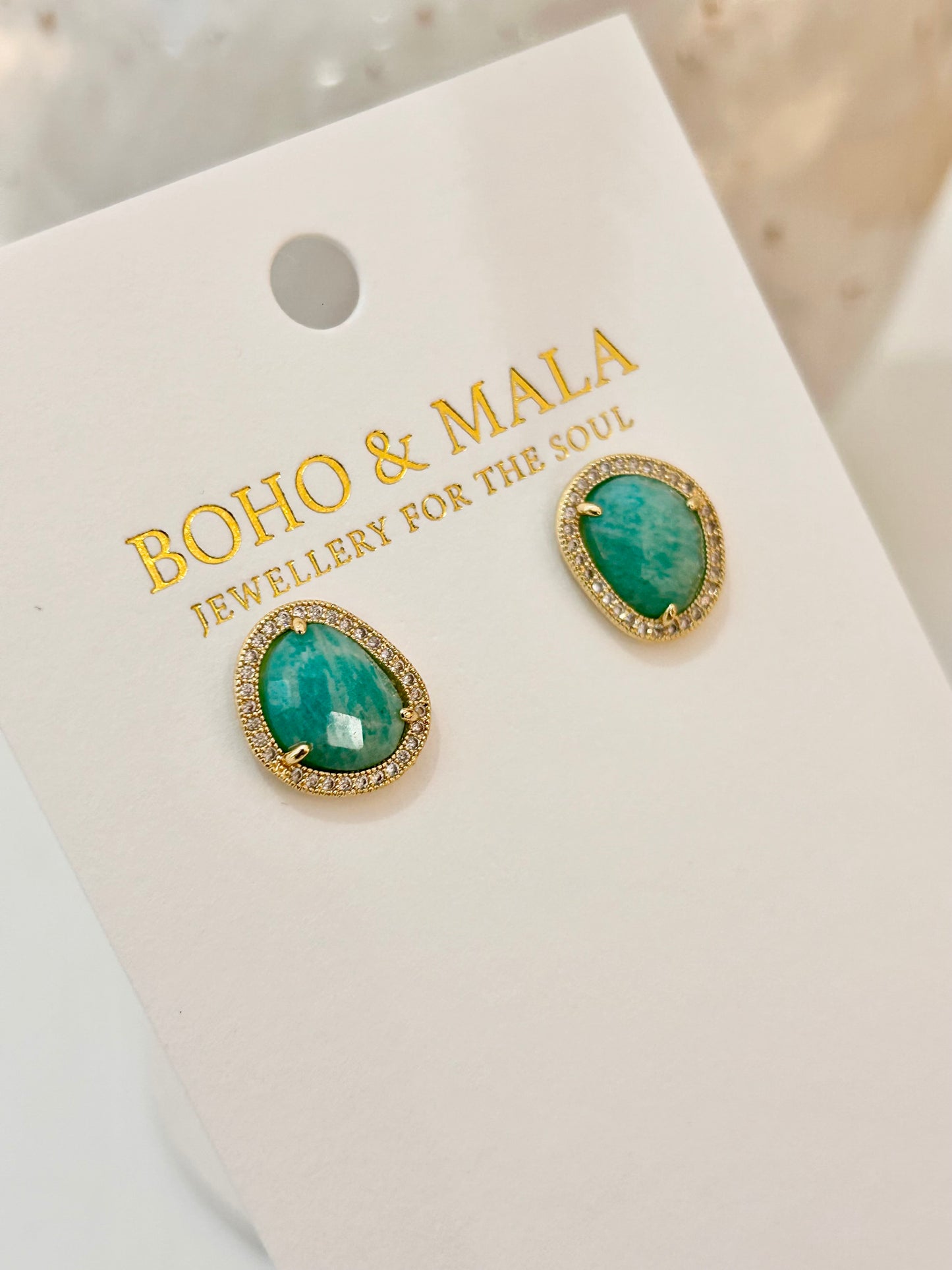 
                  
                    Green amazonite earrings on a 'Boho & Mala' branded card
                  
                