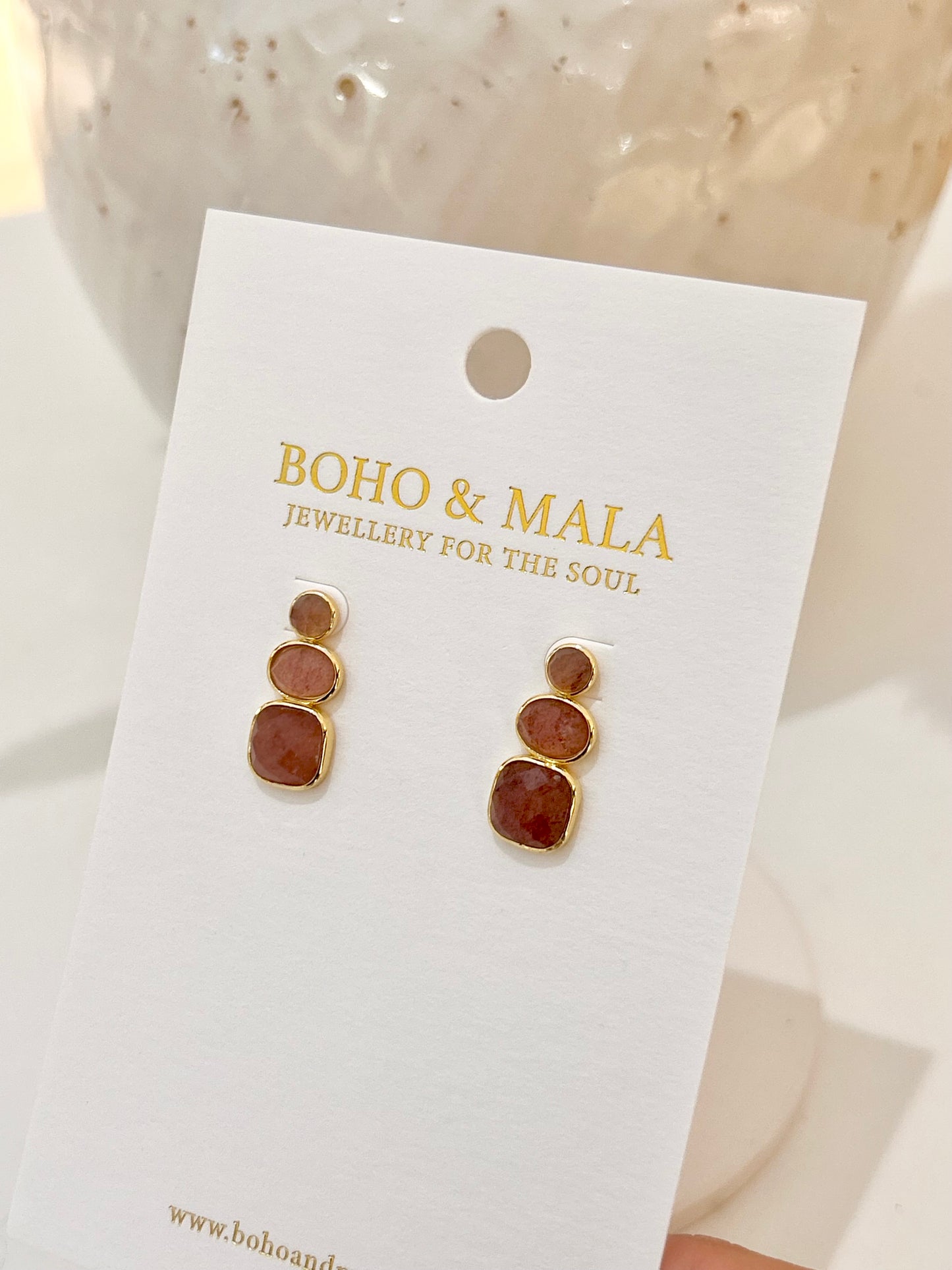 
                  
                    Pair of earrings on a 'Boho & Mala' branded card with a neutral background
                  
                