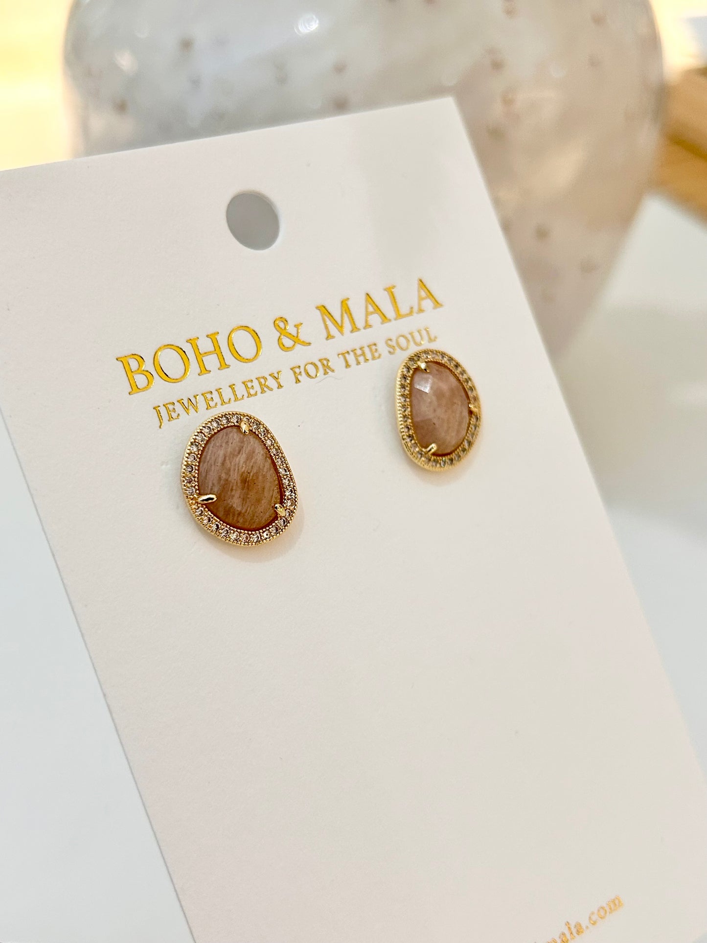 
                  
                    Pair of earrings on a 'Boho & Mala' branded card.
                  
                