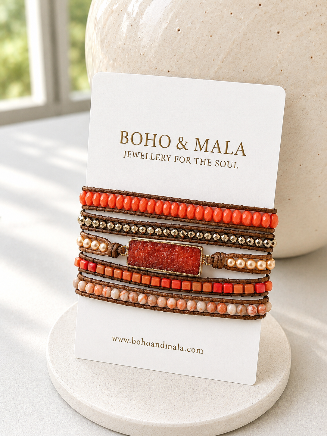 Stack of coral druzy mixed stones wrap bracelets on a white card with 'Boho & Malia' branding.