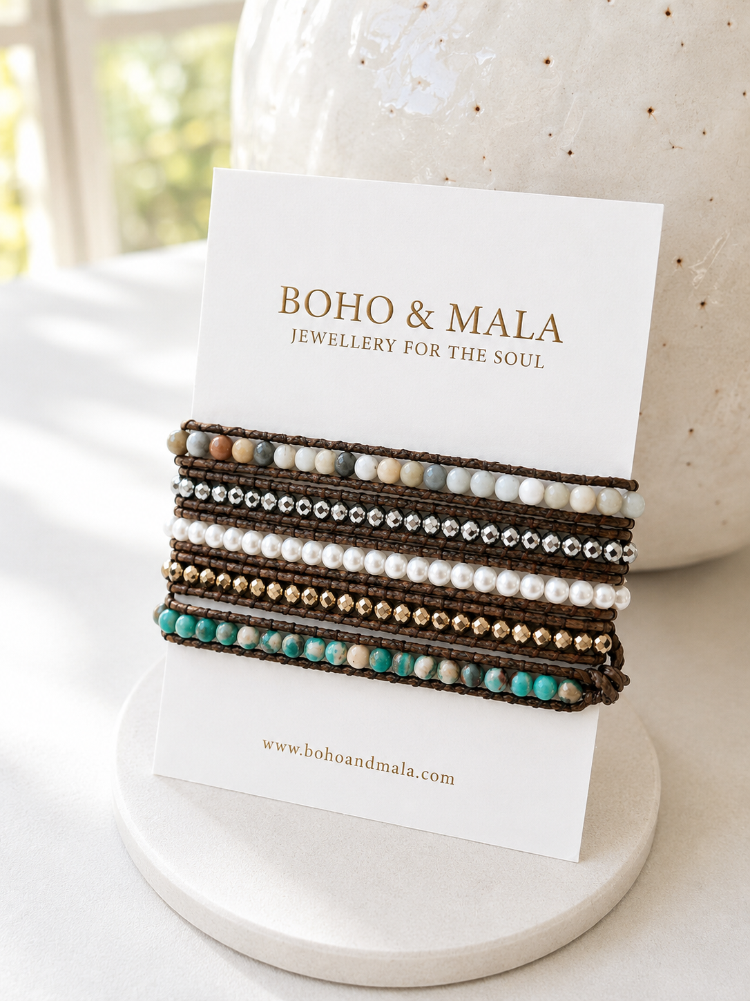 Set of freshwater pearl wrap bracelets on a card with 'Boho & Mala' branding on a light background