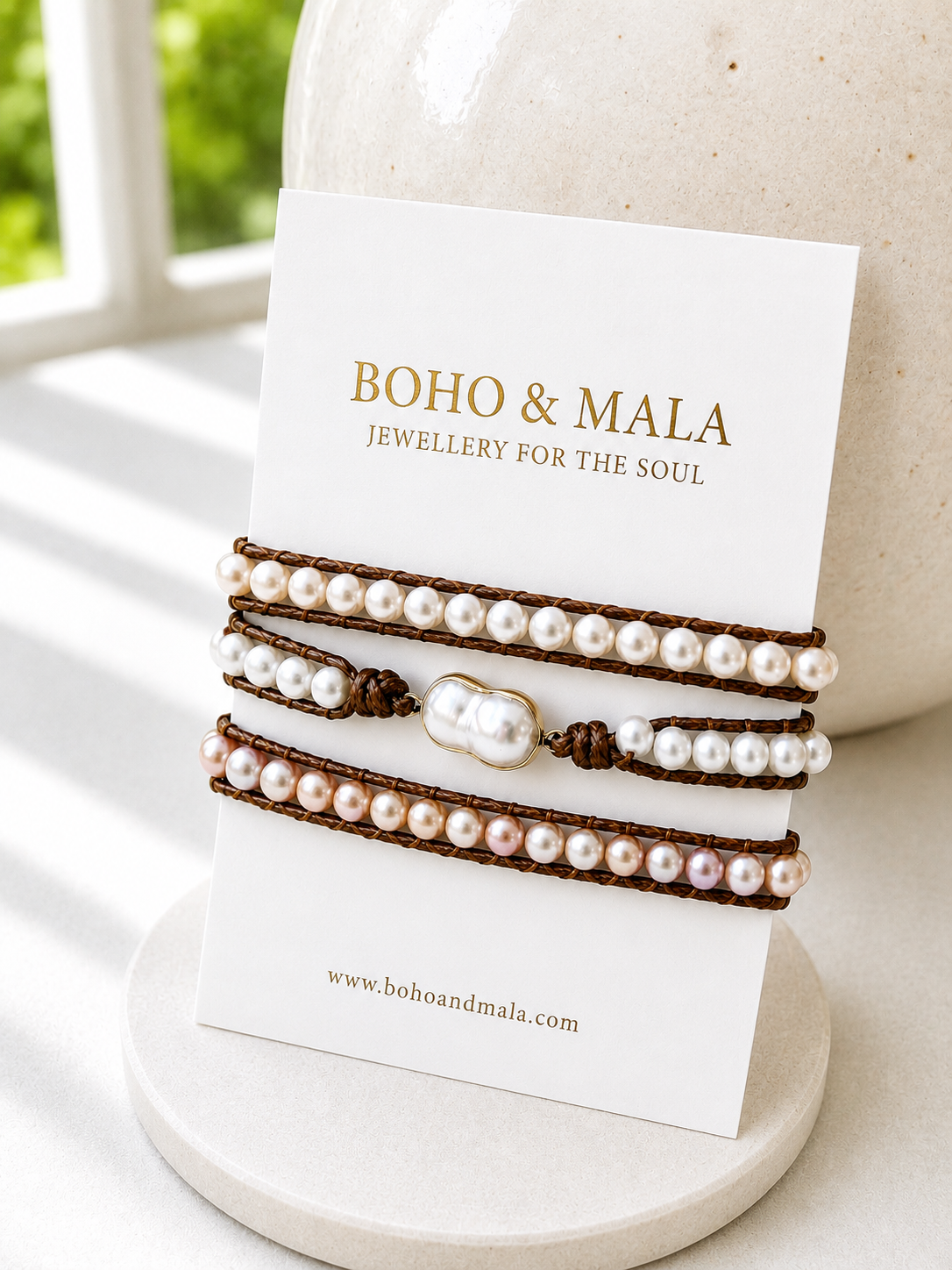 Pearl wrap bracelets on a card with 'Boho & Mal' branding, displayed on a white surface.