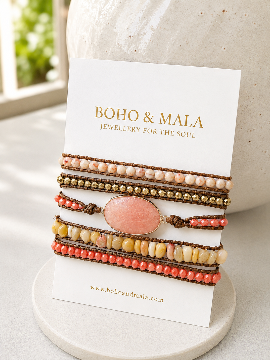 Set of peach jade mixed beaded wrap bracelets on a card with 'Boho & Mala' branding.
