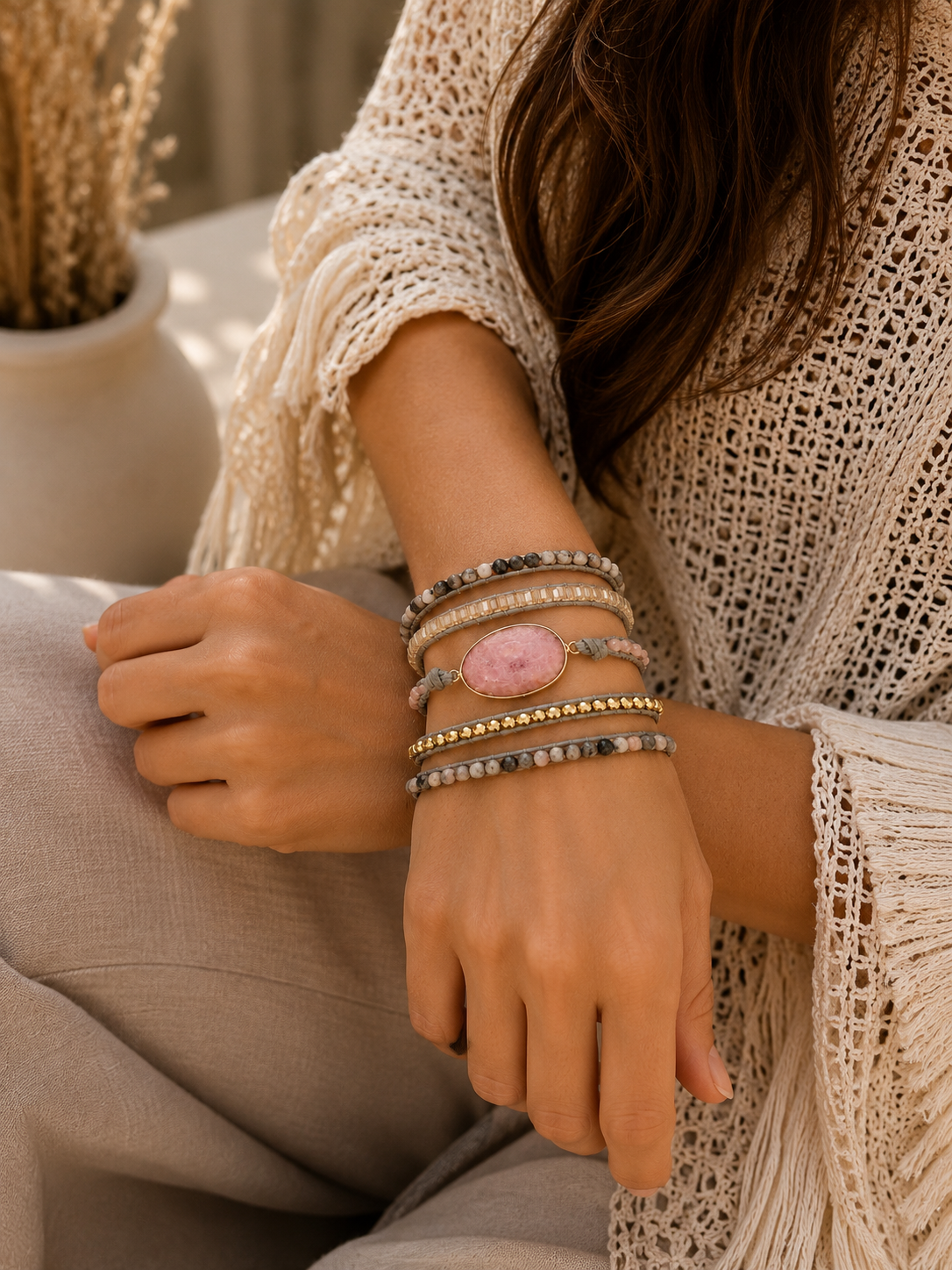 
                  
                    Person wearing wrap bracelets on a blurred natural background
                  
                
