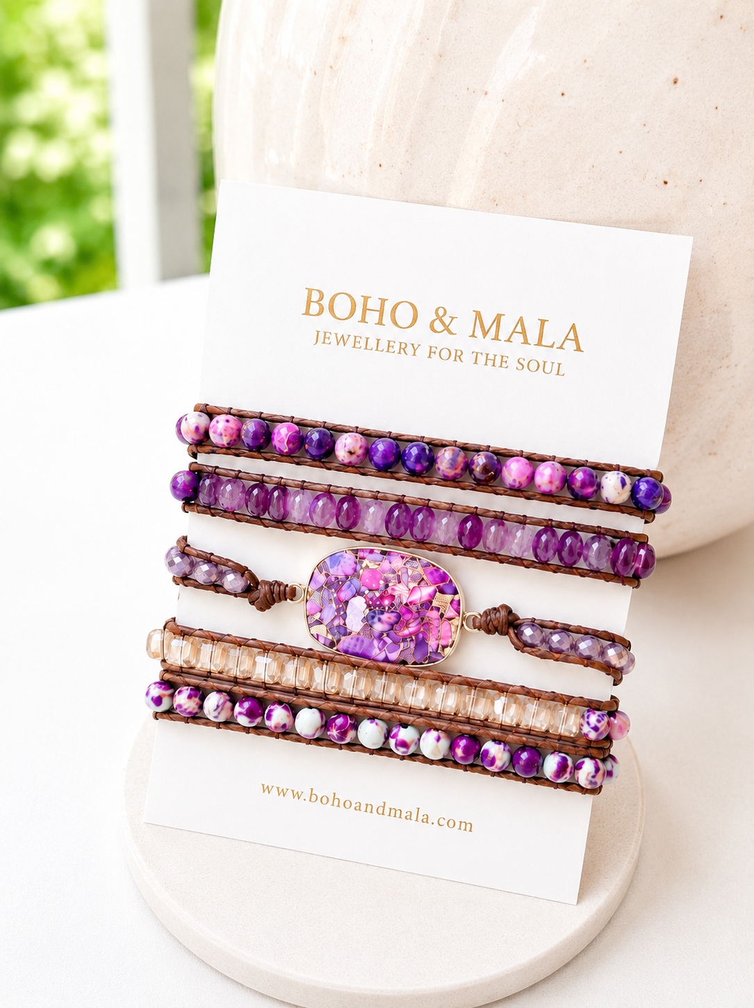 Set of beaded mixed purple imperial jasper stone wrap bracelets on a card with 'Boho & Mala' branding.