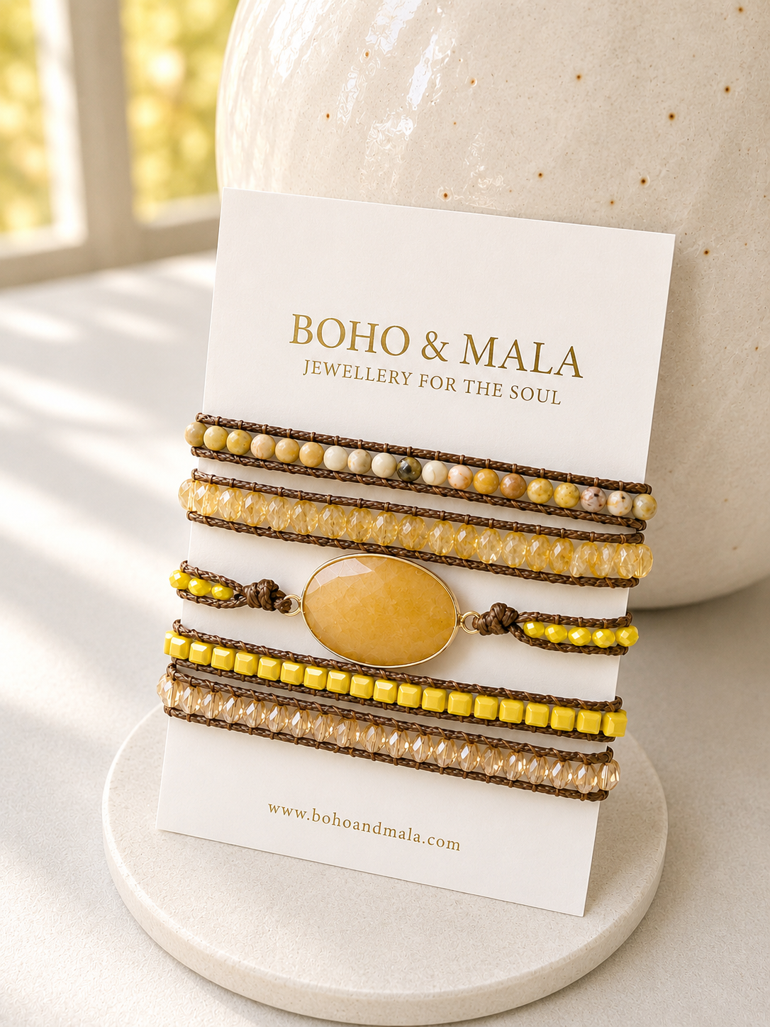 Set of beaded yellow jade mixed wrap bracelets on a card with 'Boho & Mala' branding.