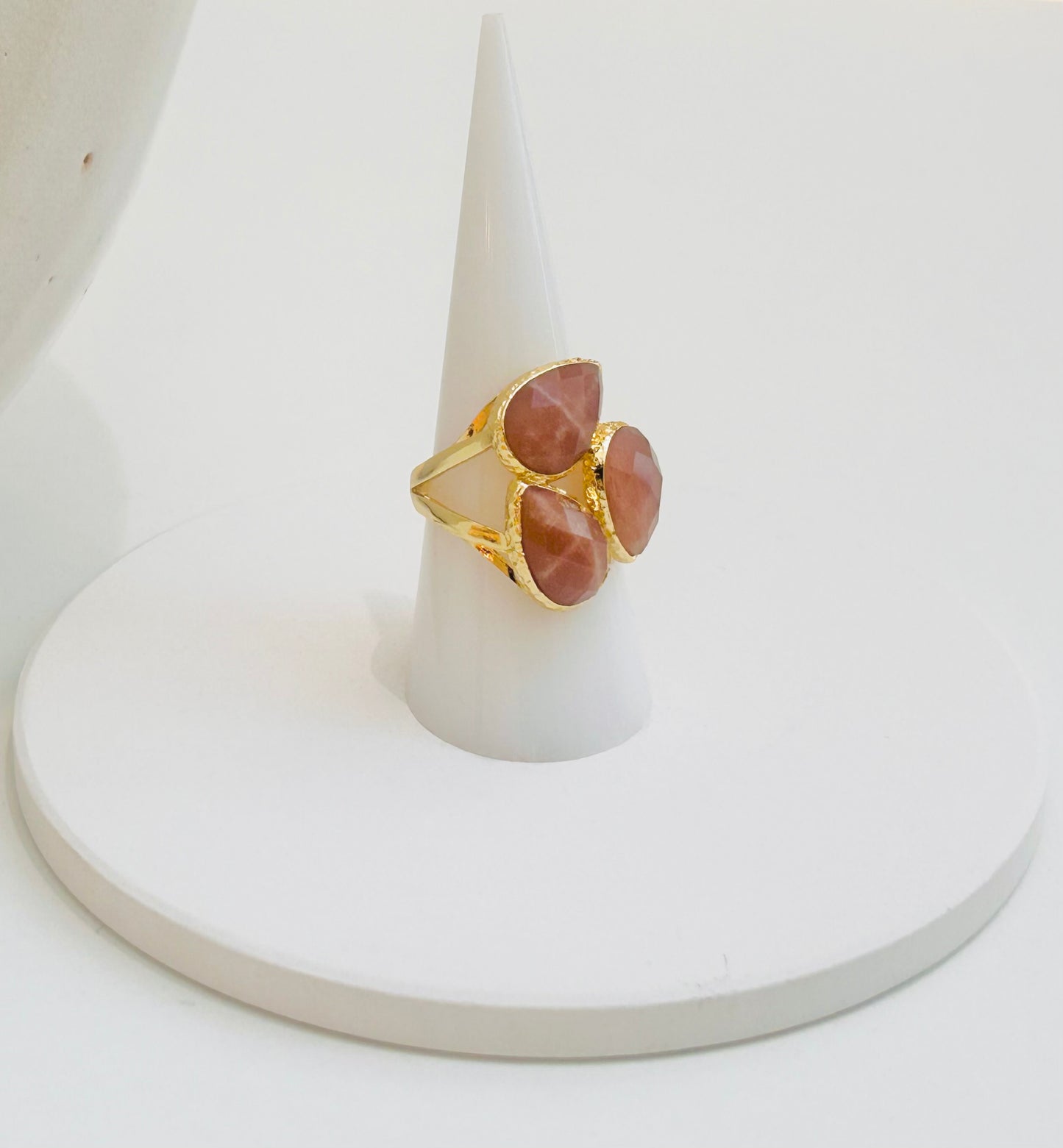
                  
                    Seraphine sunstone Statement Ring featuring three faceted sunstone gemstones in a clustered gold-plated design by Boho & Mala.
                  
                