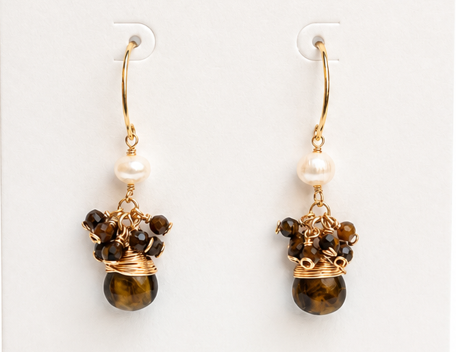 Pair of earrings on a BOHO & MALA branded card with a white background