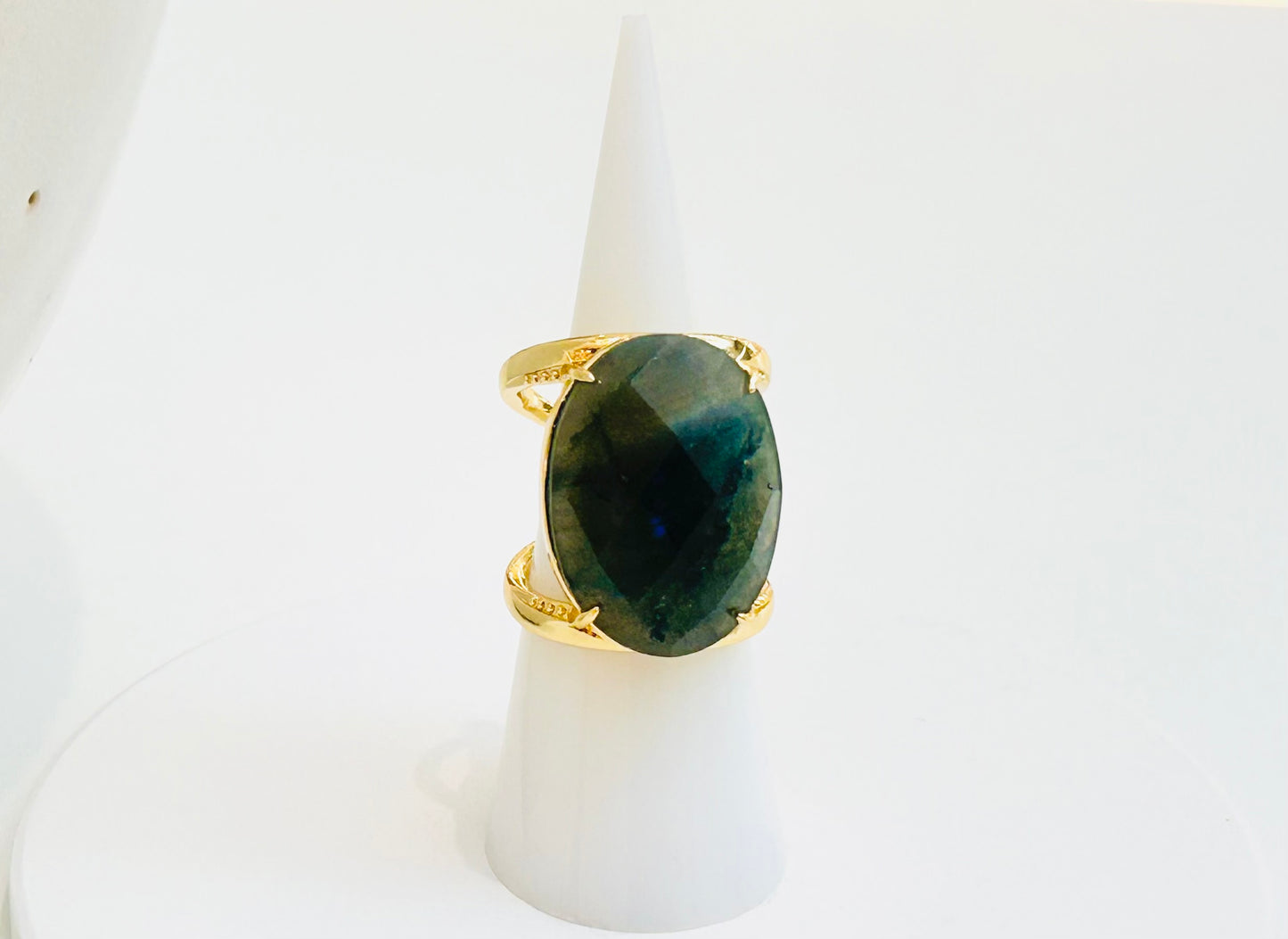 
                  
                    Aurevia Labradorite Statement Ring featuring a natural smoky grey oval Labradorite gemstone set in a sculptural tarnish-free gold-plated band.
                  
                