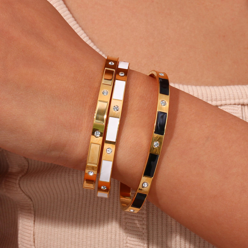 
                  
                    Gold Cuff Bracelets with Black Enamel at Boho & Mala
                  
                